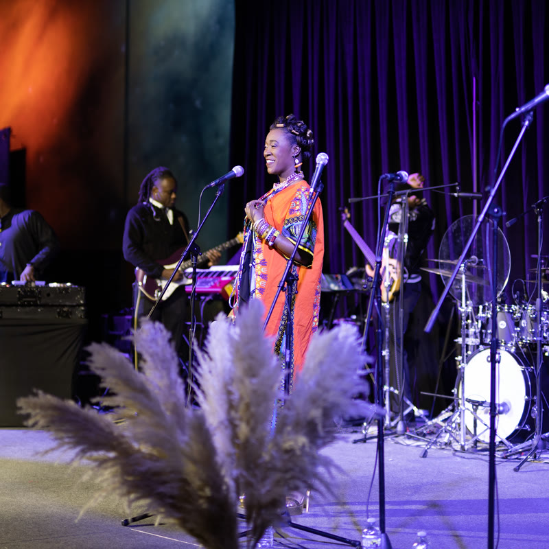 Singer performing with the band at Africa LIVE!